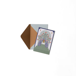Greeting card with peacock design and matching envelope on a white background