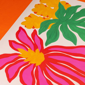 Colorful floral design with pink flower, yellow center, green leaves on an orange background