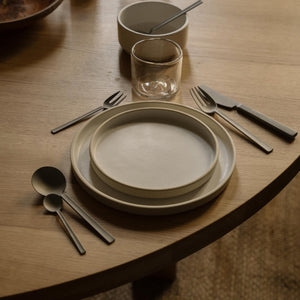 FRAMA X OLE PALSBY CUTLERY with plates on wooden table