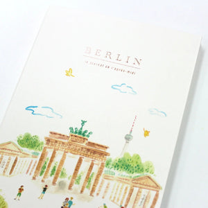 Notebook with illustrations of Berlin landmarks on a white background