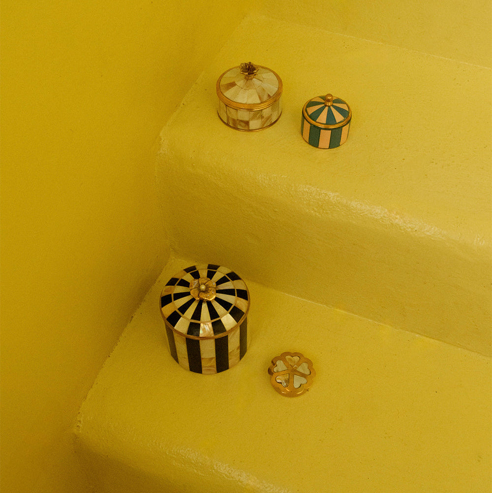 Decorative boxes on a yellow surface with a yellow background