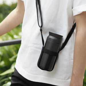 man carries kinto travel tumbler in black
