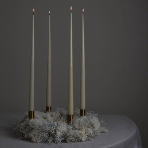 gold candle stick on xmas wreath with candles
