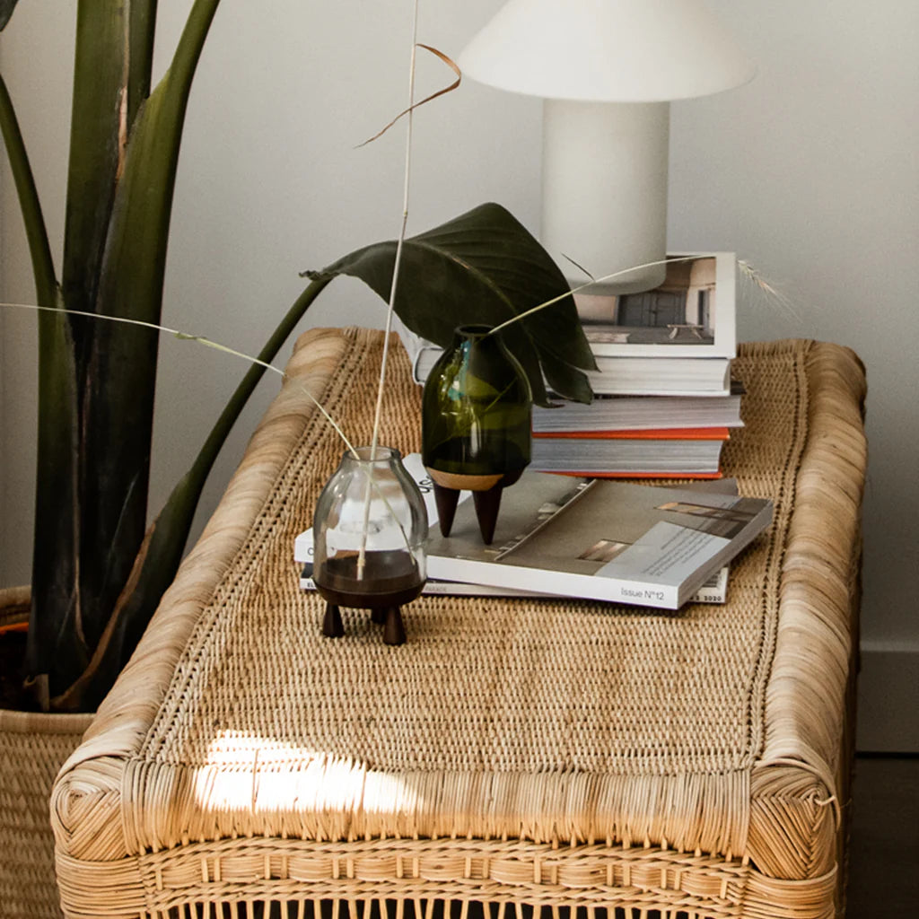 malawi bench used as side table with books on it