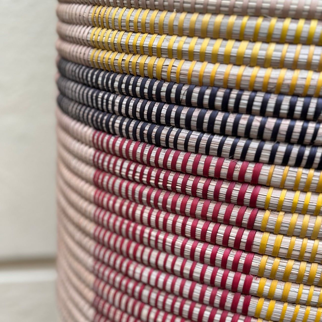 red yellow black handwoven into laundry basket mtundu