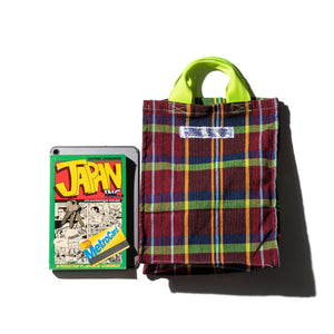 rectangular shape document bag made from upcycled fabric with a comic book next to it