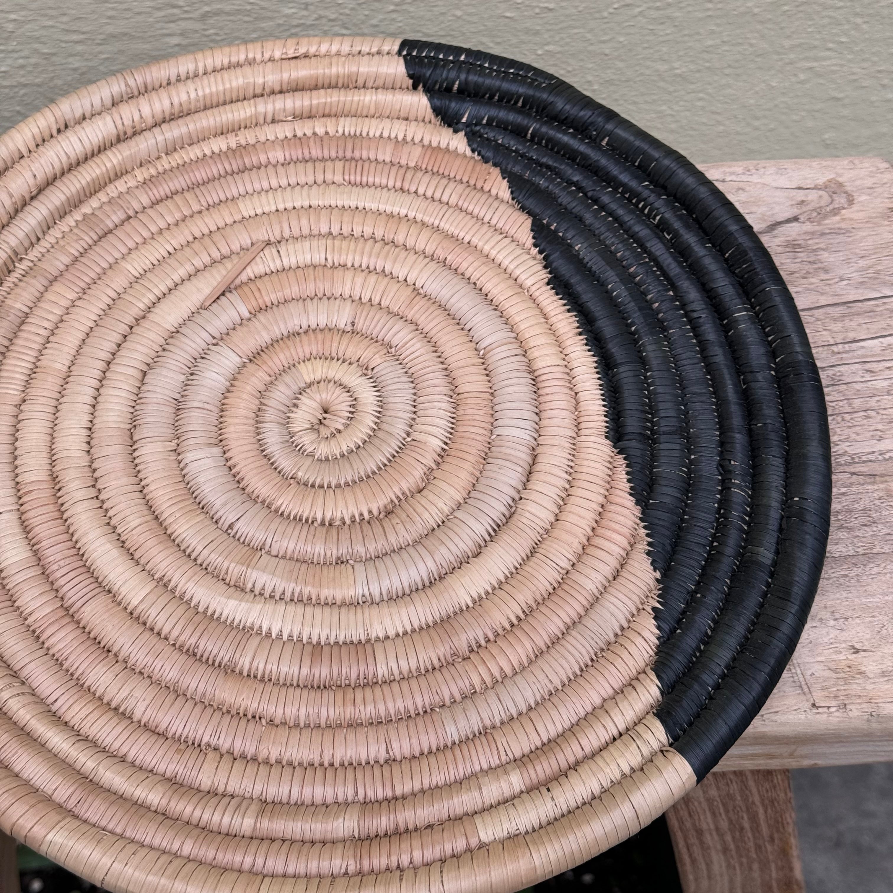 handwoven wall decor with black pattern