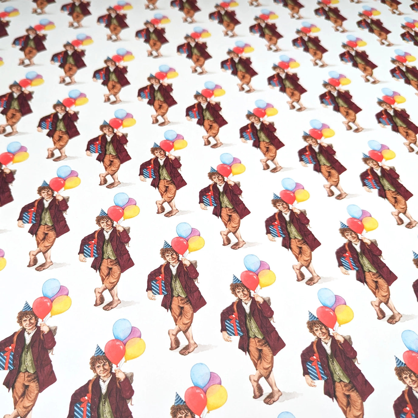 Gift wrapped with blue ribbon and scissors on a patterned background