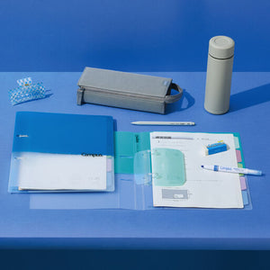 Stationery items including a blue folder, pen, and small containers on a blue background