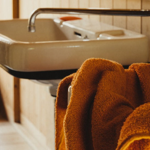 berlin frama heavy hand towel in burnt orange