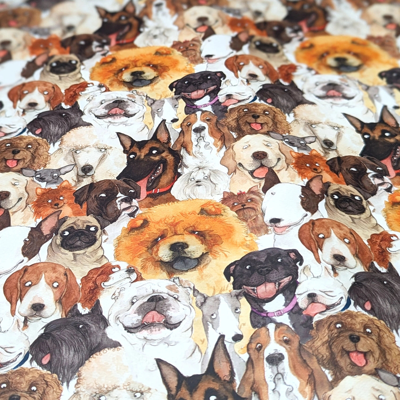 Gift box with dog pattern and purple ribbon surrounded by more dog images