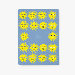 Notebook with sun-patterned cover on a white background