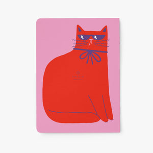 Notebook with a red cat illustration on a pink cover