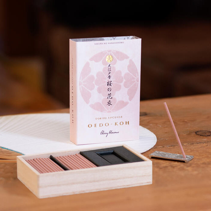 Incense box with a white label featuring Japanese text and an image of incense sticks.