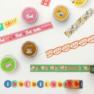 Collection of colorful washi tape rolls with various designs on a white background