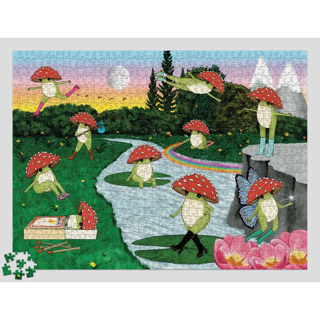 Boxed children's puzzle titled "The Little Frog" with a whimsical illustrated cover showing frogs under red mushrooms in a landscape, plus the text "1,000-piece puzzle" and "Maybell Eeouay.".