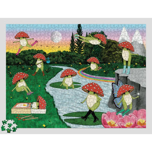 A completed jigsaw puzzle featuring whimsical frog characters wearing red-and-white mushrooms, set in a colorful outdoor scene with a stream, rainbow, mountains, and flowers. A small loose puzzle piece cluster sits in the lower-left corner against a light gray background.