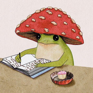 Illustration of a frog wearing a red mushroom hat, reading a book with a cupcake on a beige surface.