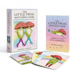 The Little Frog Matching Game set by Maybelline Eeqouay, featuring a pastel illustrated box, a smaller booklet/card, and several matching cards with green frogs and red mushroom caps on a white background.