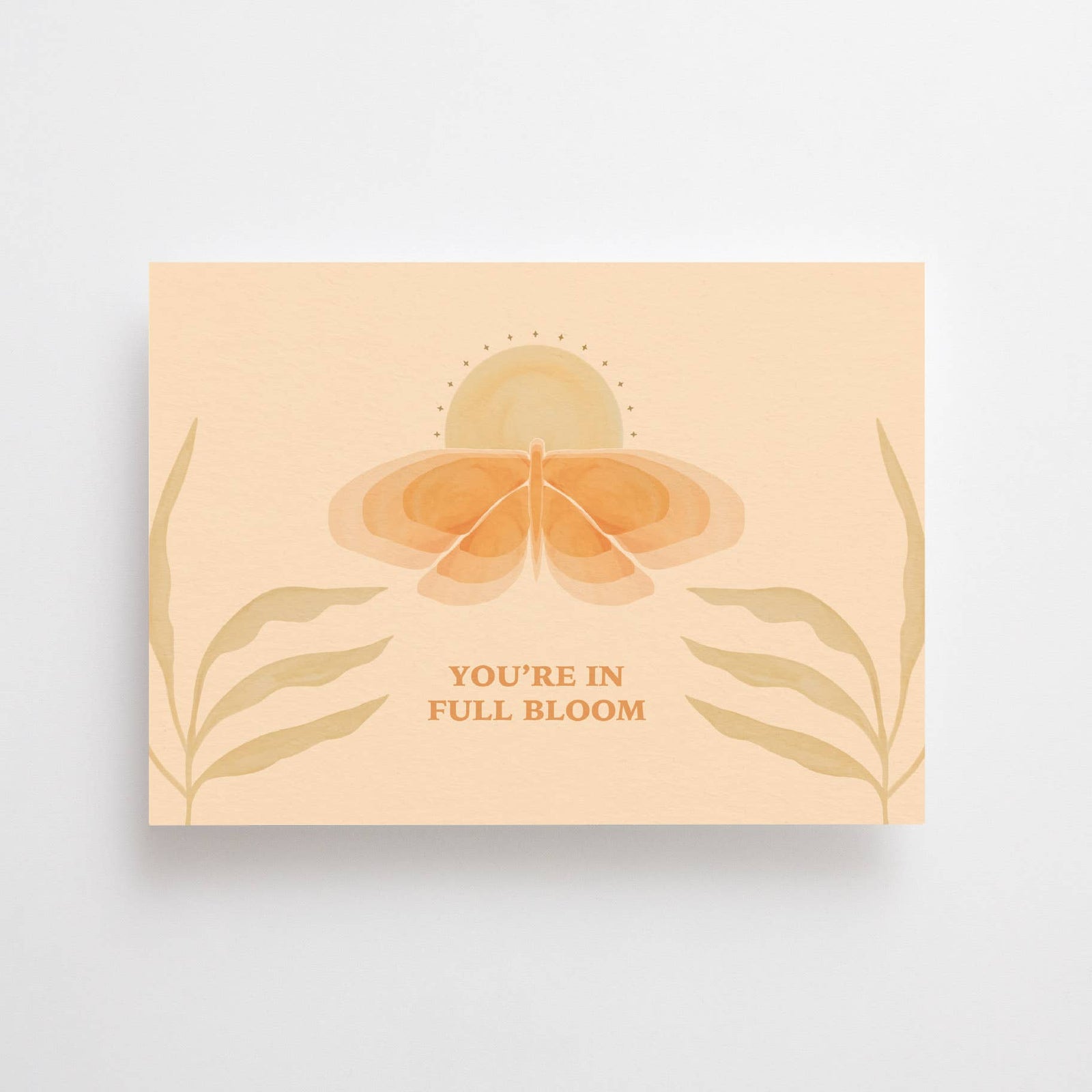 post card with the writing "you are in full bloom"