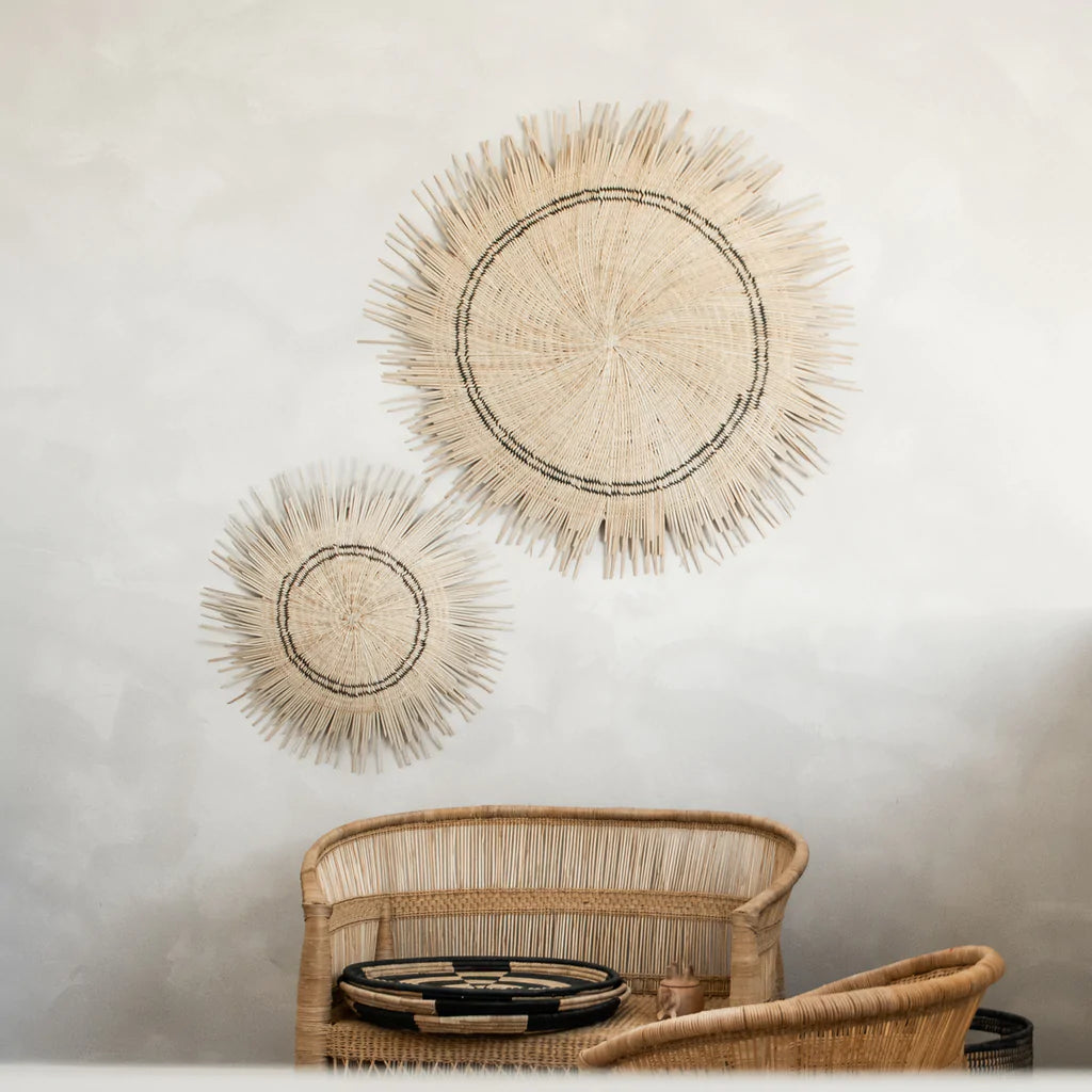 natural colour sun circle wall decor hang on top of a bed